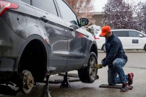 A Mechanic changing car tire